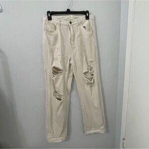 Off white cream high waisted distressed baggy jeans.